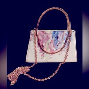 Ted Baker clutch . Pink gold accents